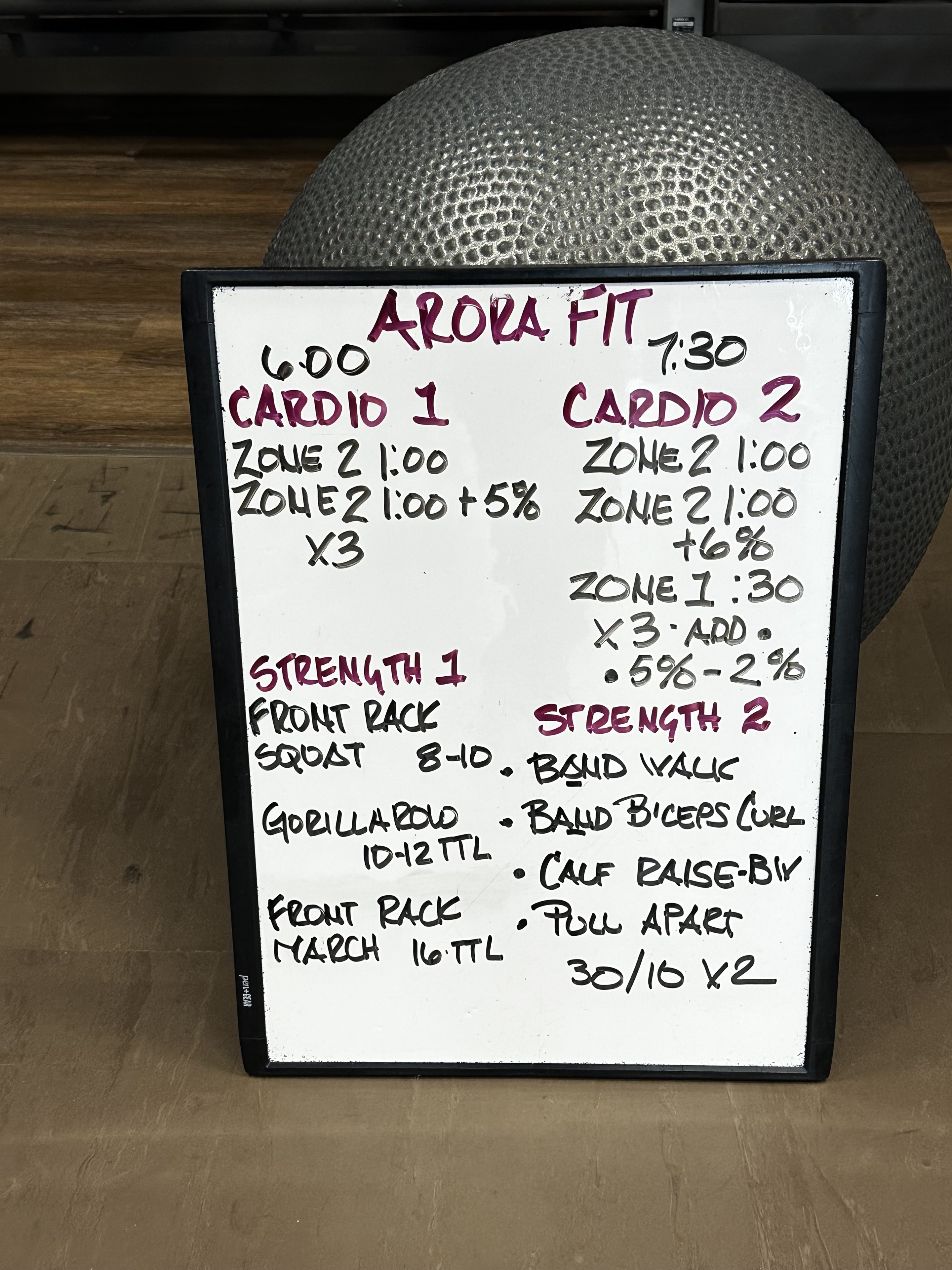 Aloha Fit whiteboard showing the cardio and strength workout